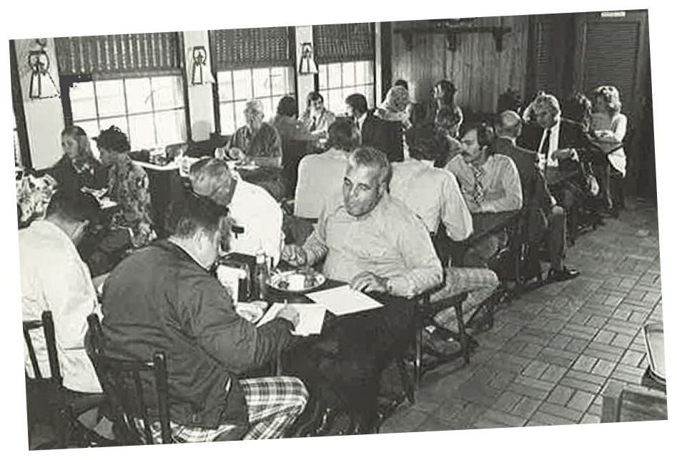 Image of the interior of a Mr. D's Seafood and Hamburgers location, showing multiple tables and booths filled with people eating a meal.